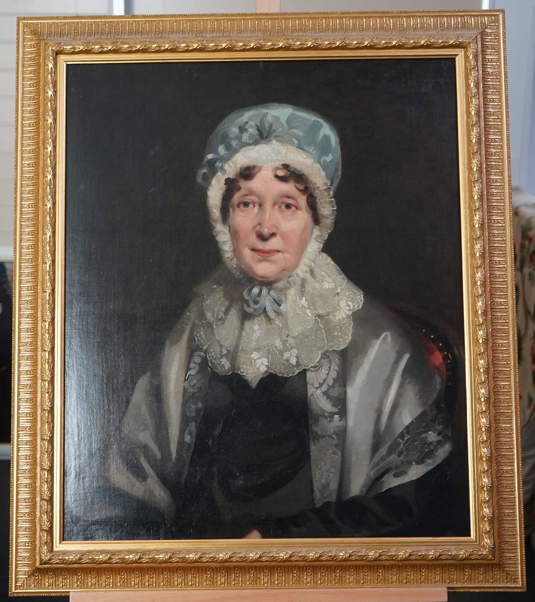 English School, 19th century, A portrait of a seated lady wearing a lace bonnet